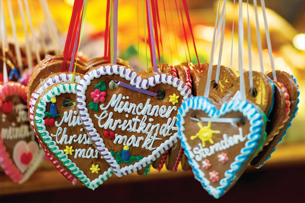 Heart shaped gingerbread ornaments hanging from a string.