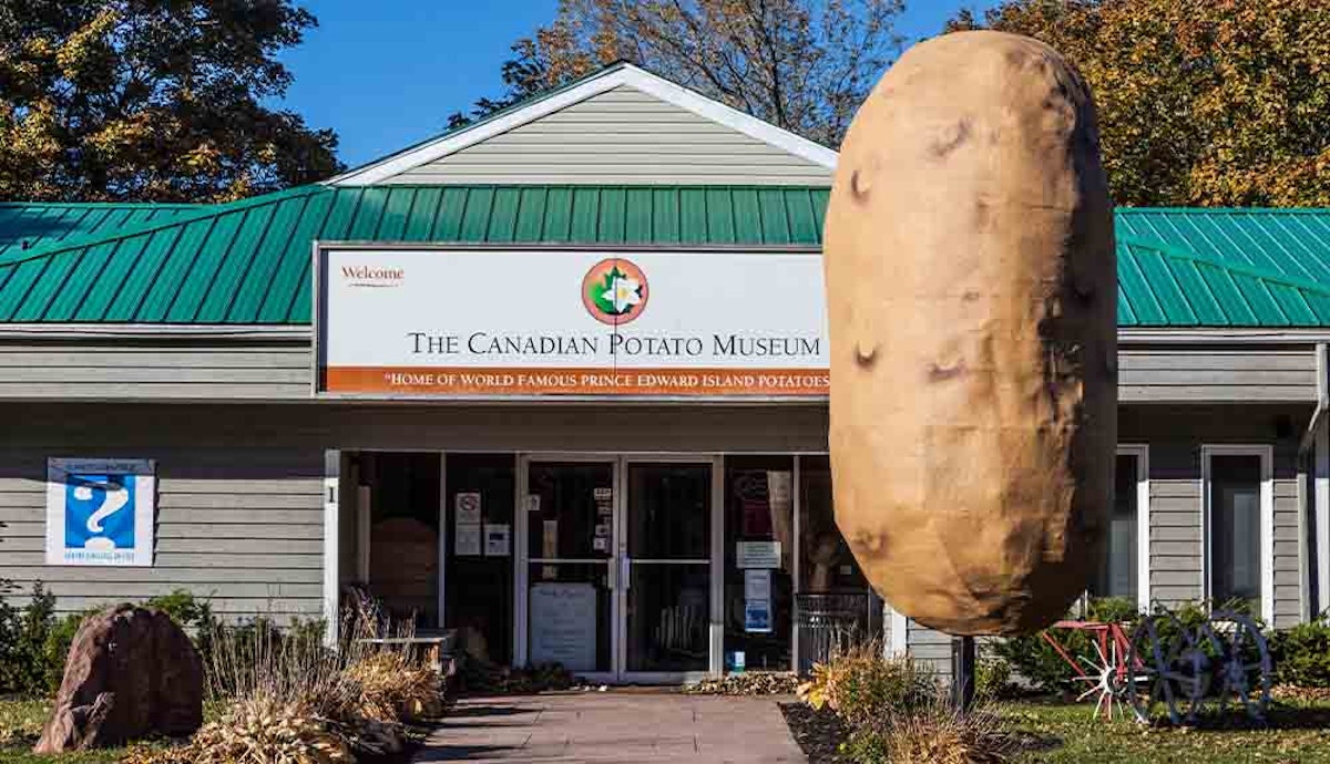 A giant potato in front of a building.