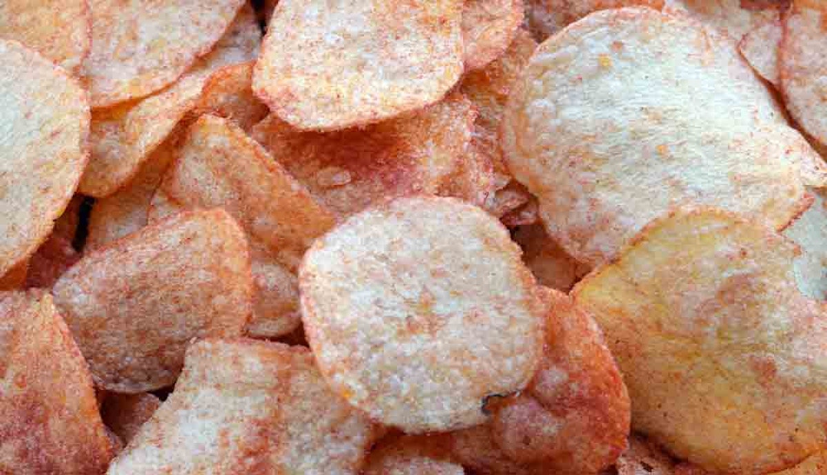 A pile of fried potato chips is shown.
