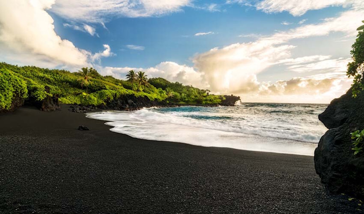A black sand beach on the island of hawaii.