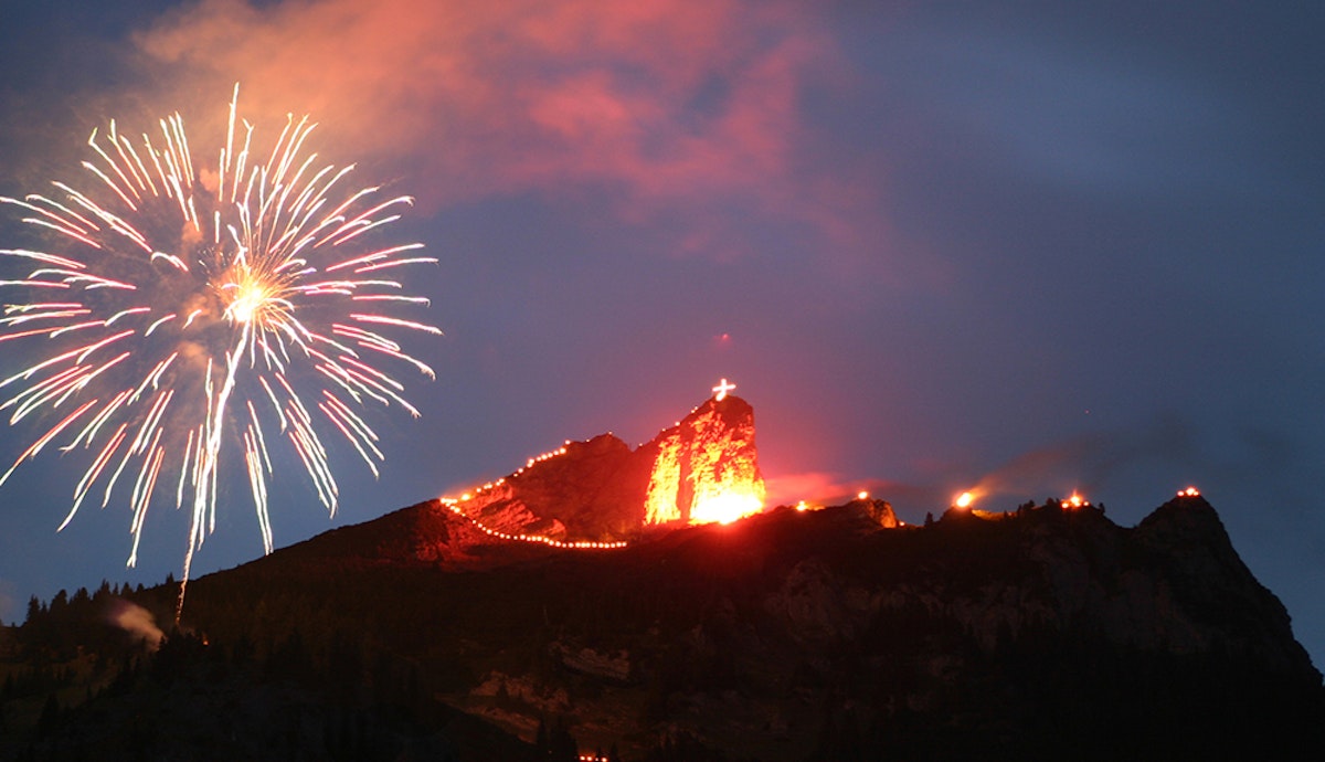 A mountain with a firework in the sky.