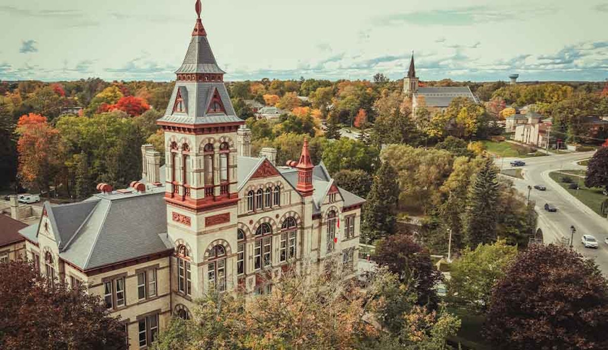 An aerial view of an ornate building in the fall.