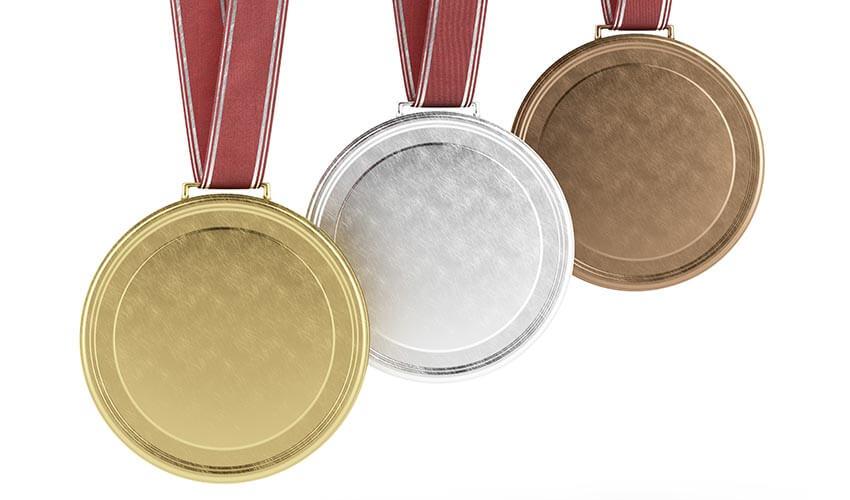 Three gold, silver and bronze medals on a white background.