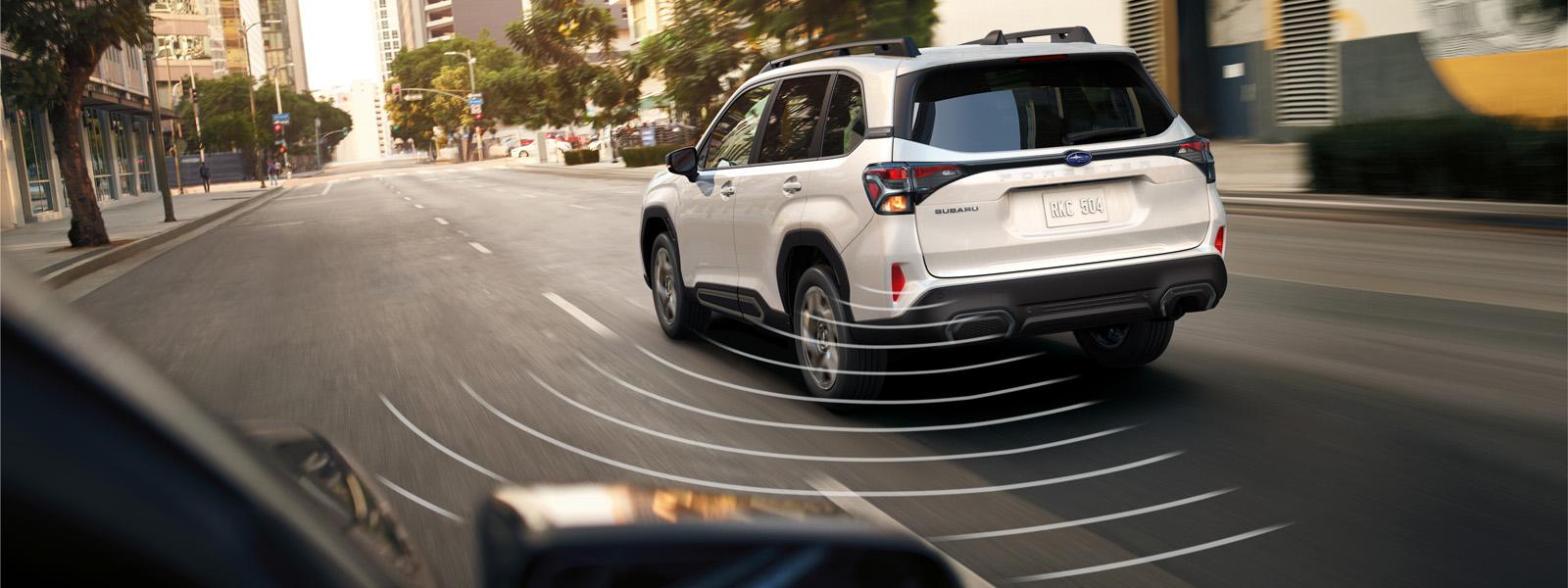 A white SUV driving down a clear city road. Emanating from the back of the vehicle are white lines simulating a frequency.
