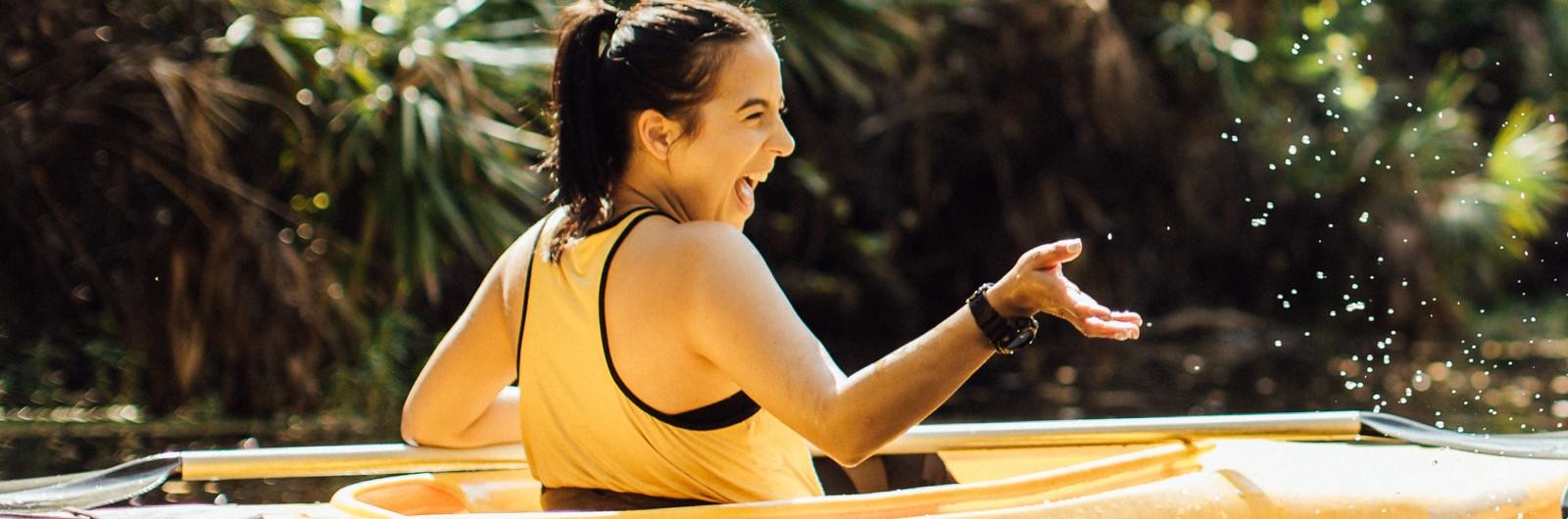 Happy woman canoeing