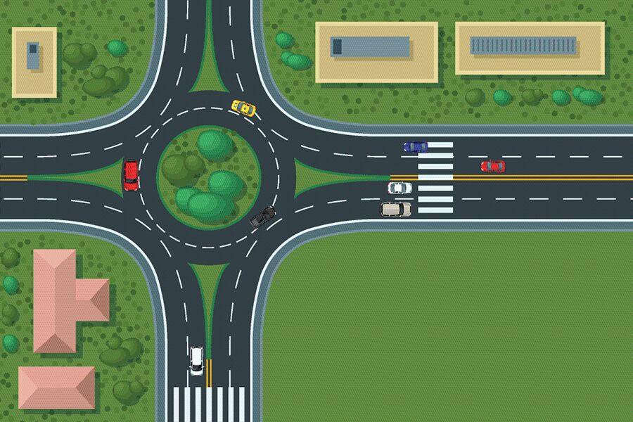 A road with cars and buildings.
