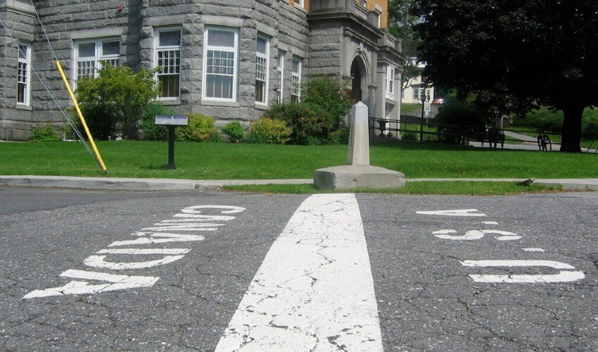 A street with a white line painted on it.
