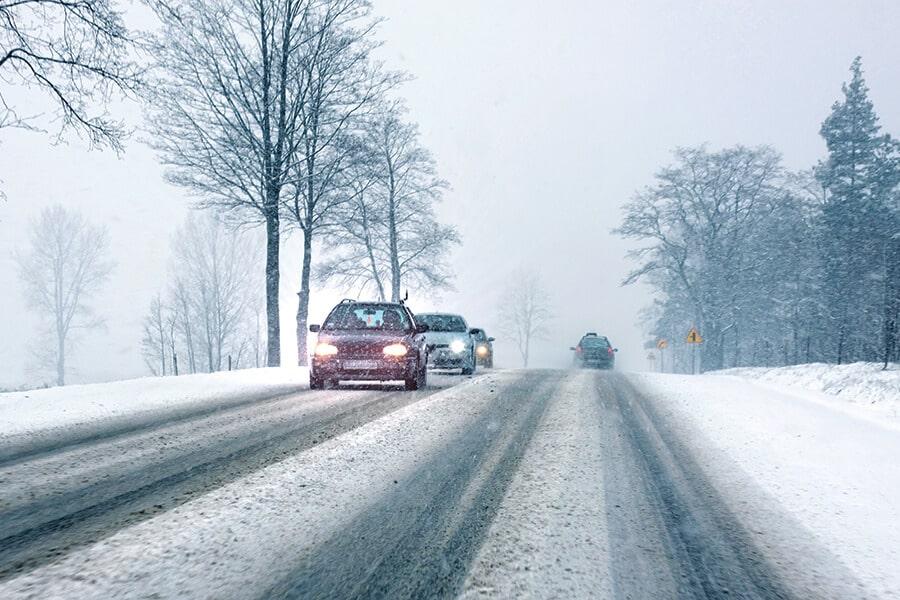 Cars on a snowy road.