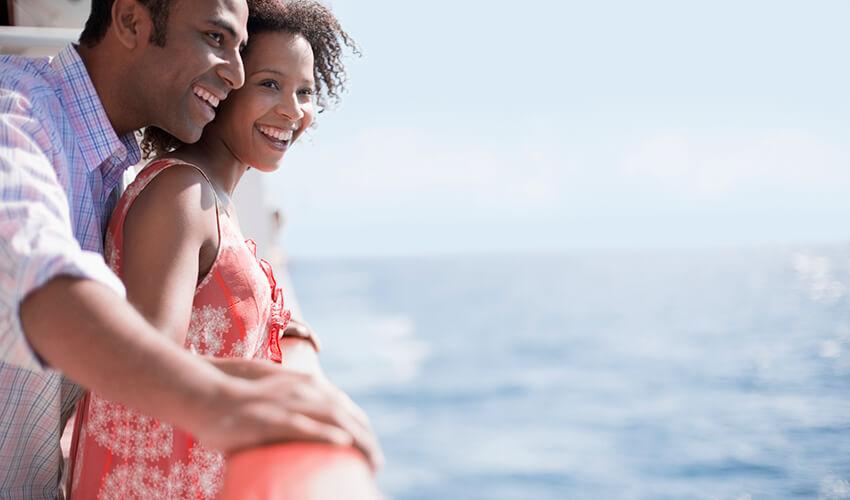 Couple enjoying a seaside view together.