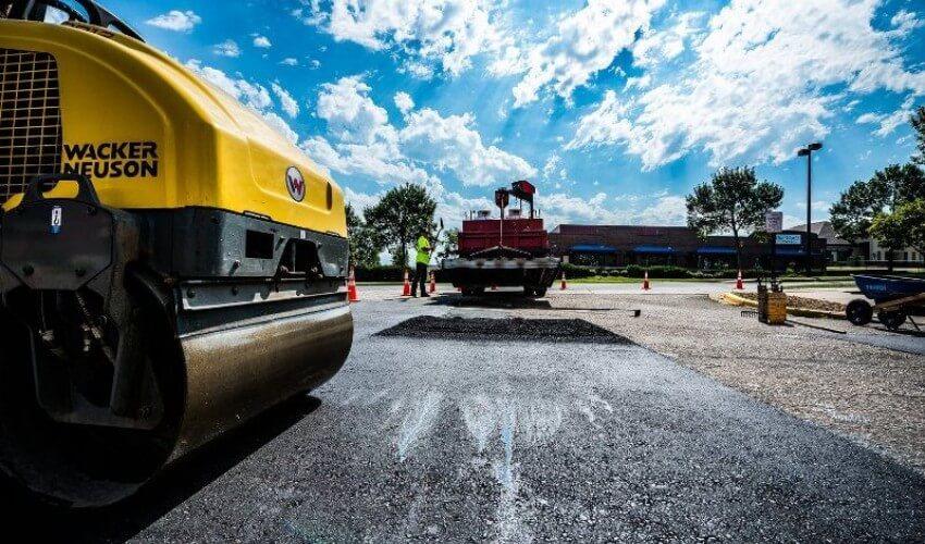A road is being paved with a road roller.