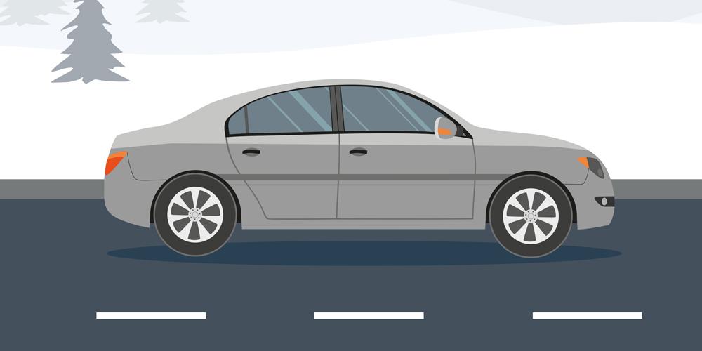 A car is parked on a snowy road.