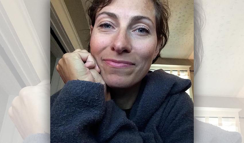 A woman taking a selfie.