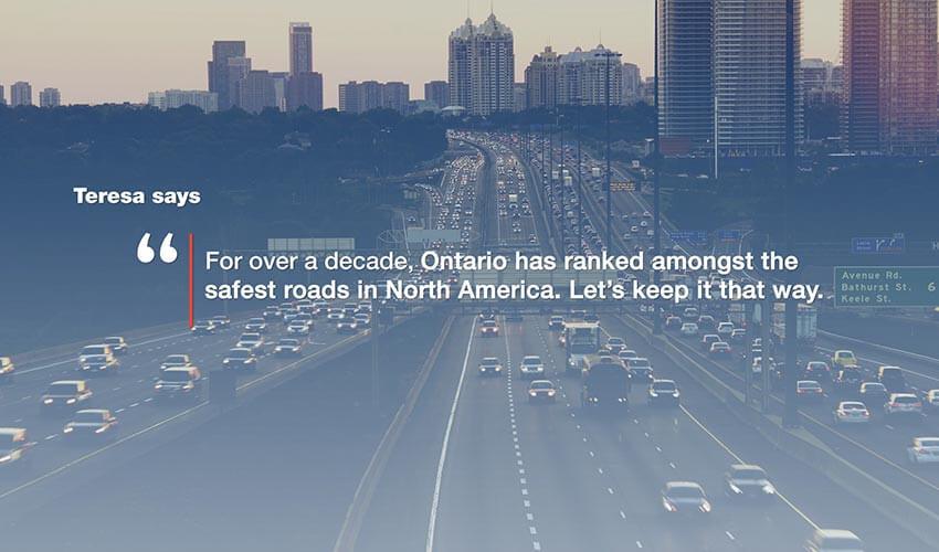 A busy multi-lane highway with a quote about road safety superimposed over the image.