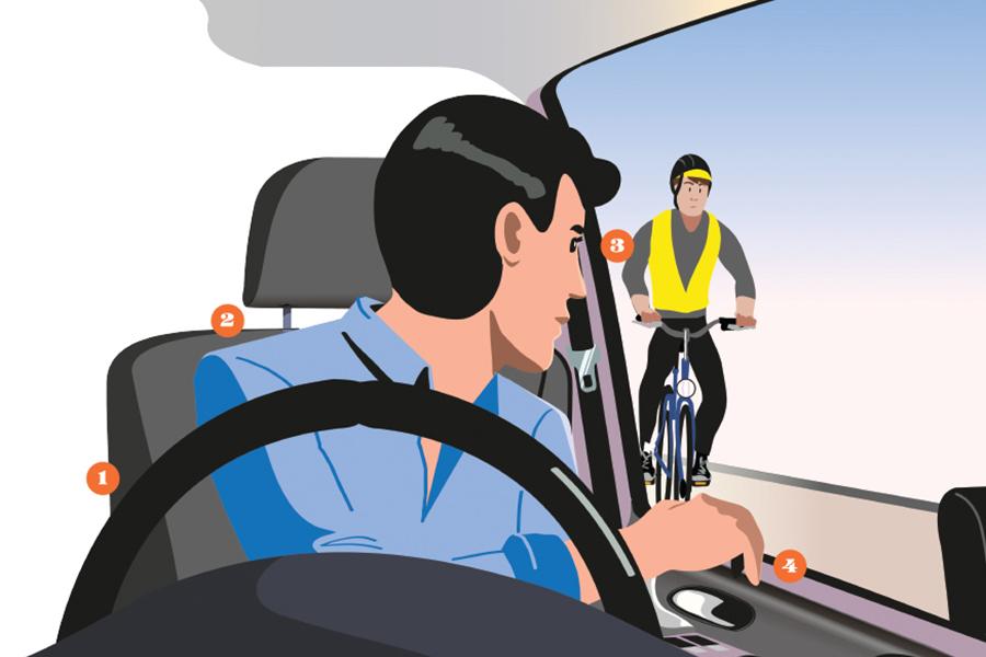 A man riding a bicycle in a car.