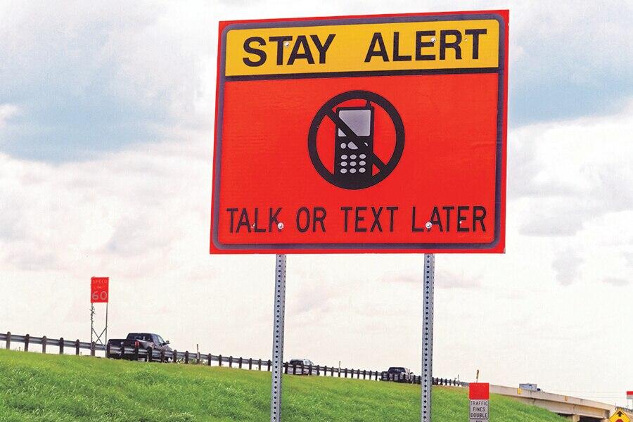 A sign on the side of a road.