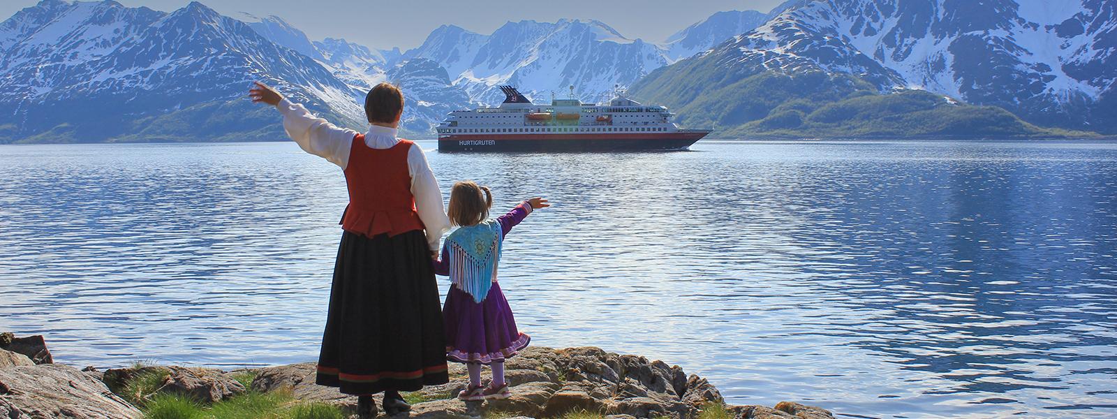 Two Generations Standing on Land Meeting Hurtigruten Norway Cruise Ship.