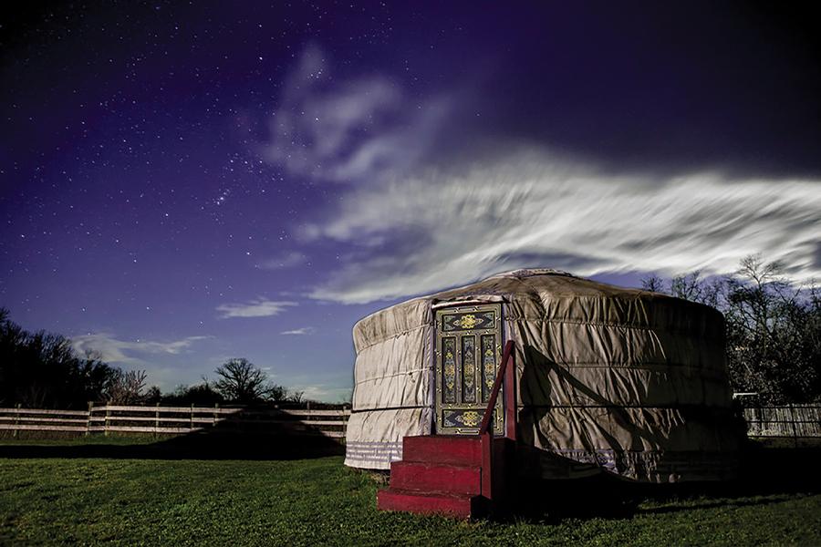 A yurt under a starry sky.