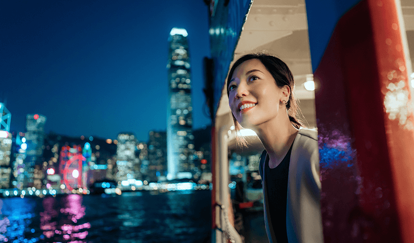 A woman looking out of a boat.