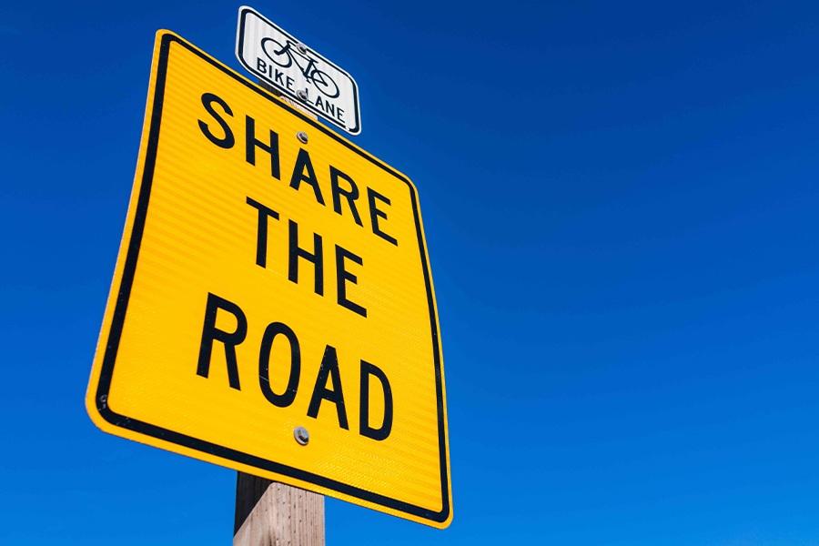 Share the road sign.