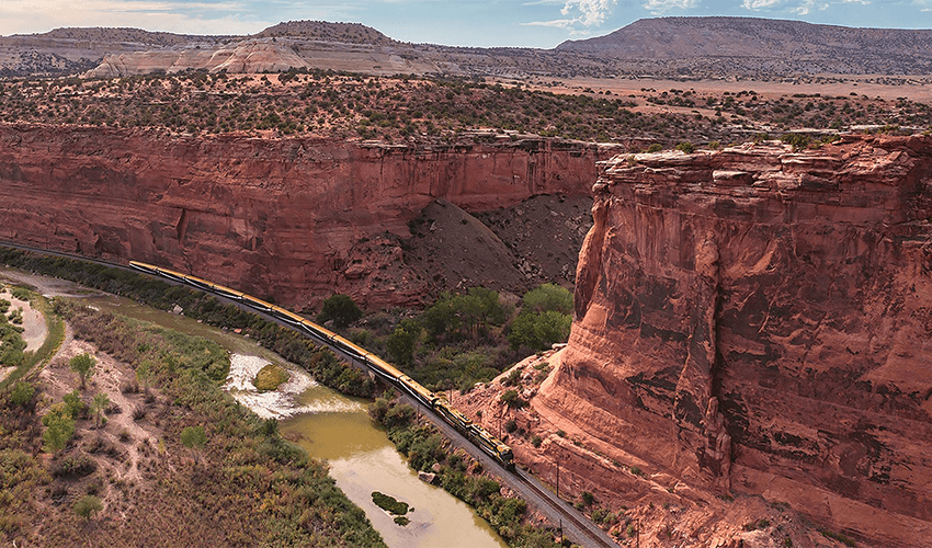 A train traveling through a canyon.
