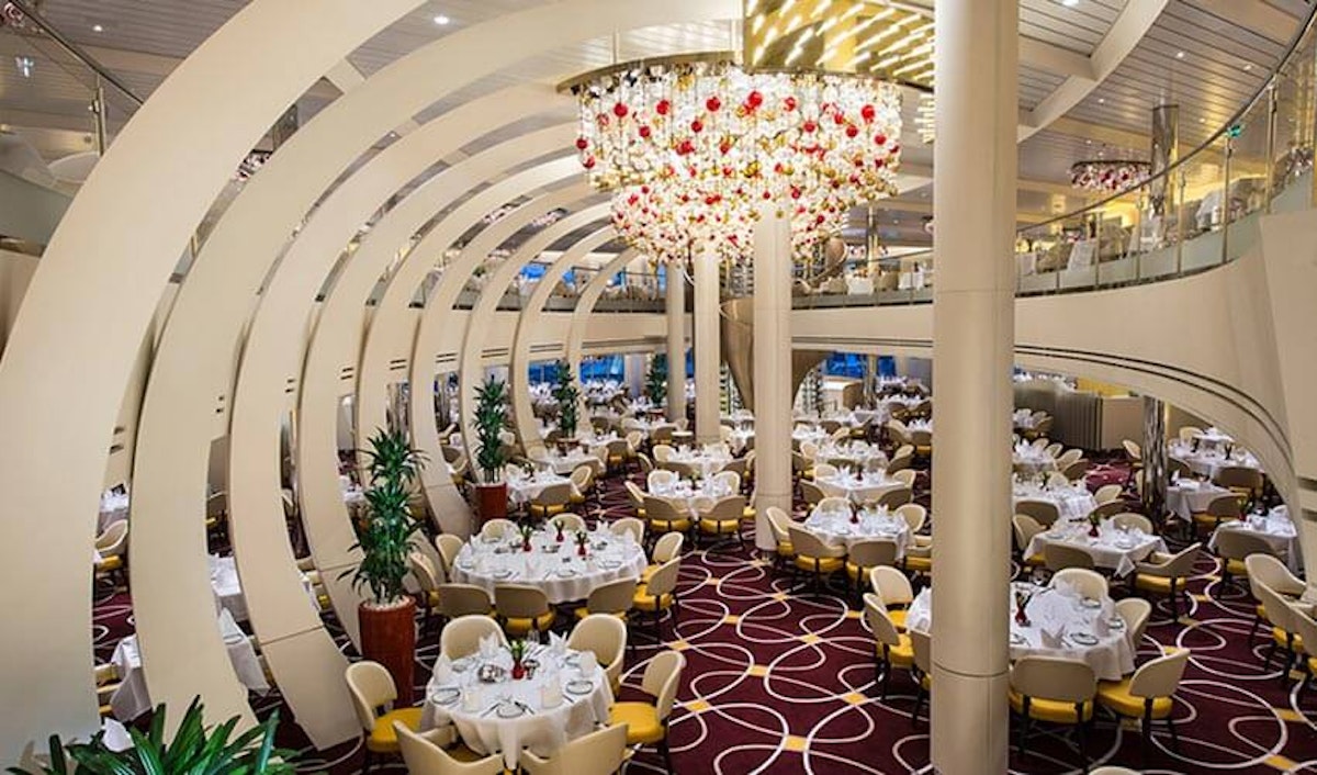 A large dining room on a cruise ship.