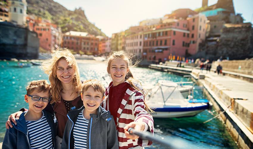 Family enjoying a sunny day at a coastal village.