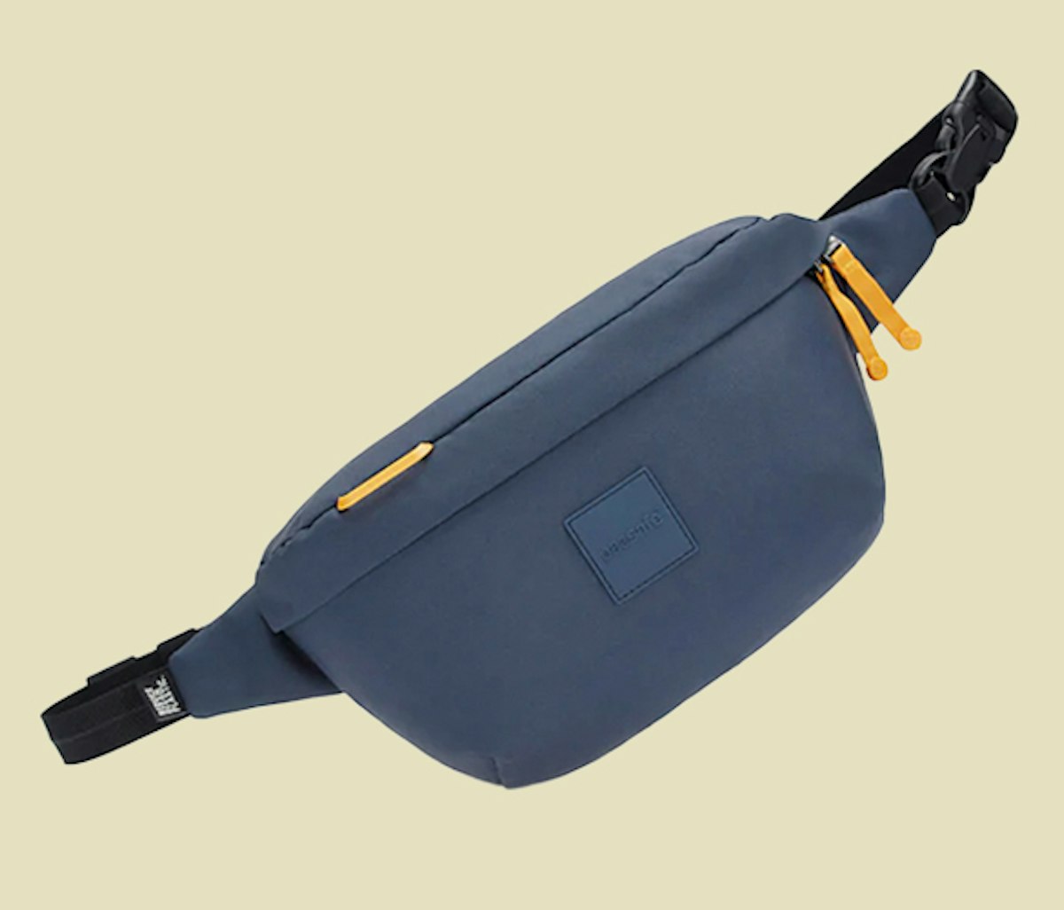 A blue fanny pack with yellow zippers.