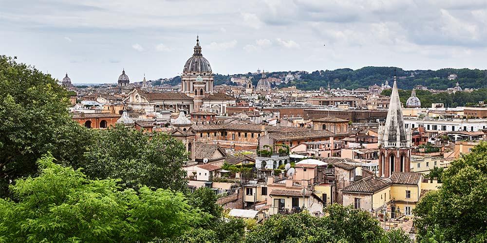A view of the city of rome from the top of a hill.