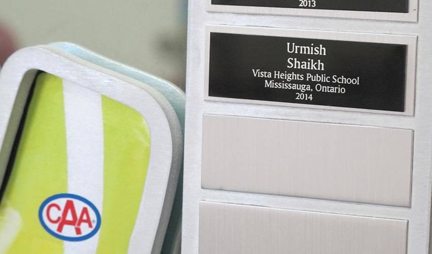 A plaque with a name on it sits on a table.