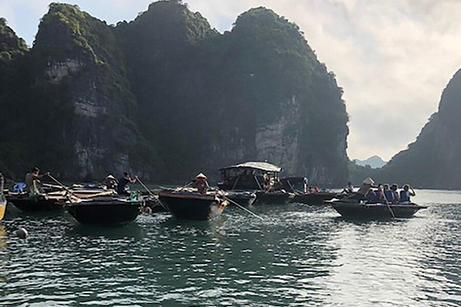 A group of small boats in a body of water.